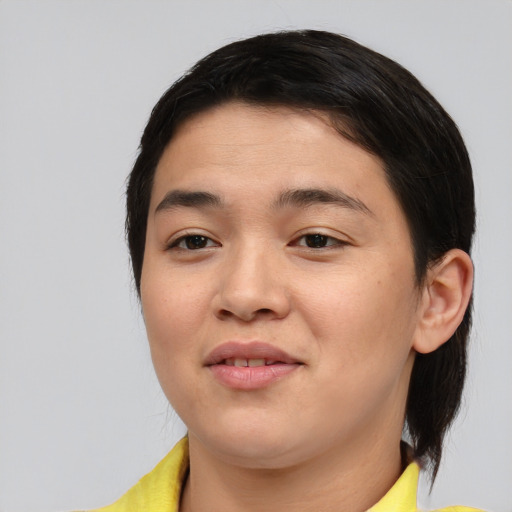 Joyful asian young-adult female with medium  brown hair and brown eyes