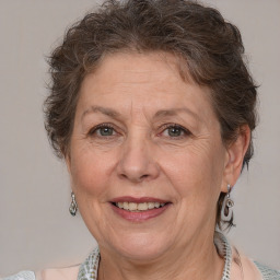 Joyful white middle-aged female with medium  brown hair and brown eyes