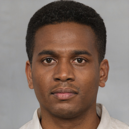 Neutral black young-adult male with short  brown hair and brown eyes