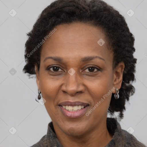 Joyful black adult female with short  brown hair and brown eyes