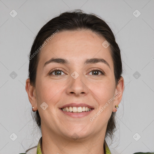 Joyful white adult female with medium  brown hair and grey eyes