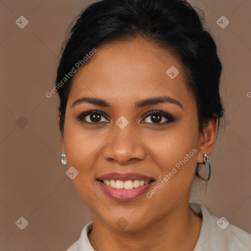 Joyful latino young-adult female with medium  brown hair and brown eyes