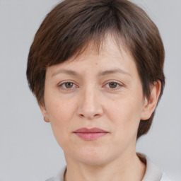 Joyful white adult female with short  brown hair and brown eyes