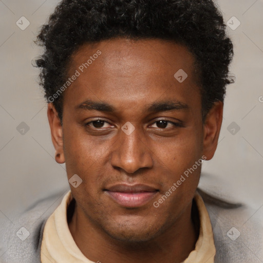 Joyful black young-adult male with short  brown hair and brown eyes