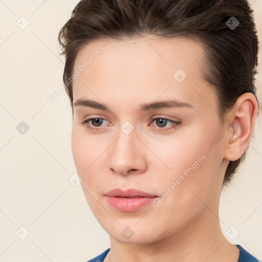 Neutral white young-adult female with medium  brown hair and brown eyes