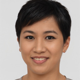 Joyful asian young-adult female with short  black hair and brown eyes