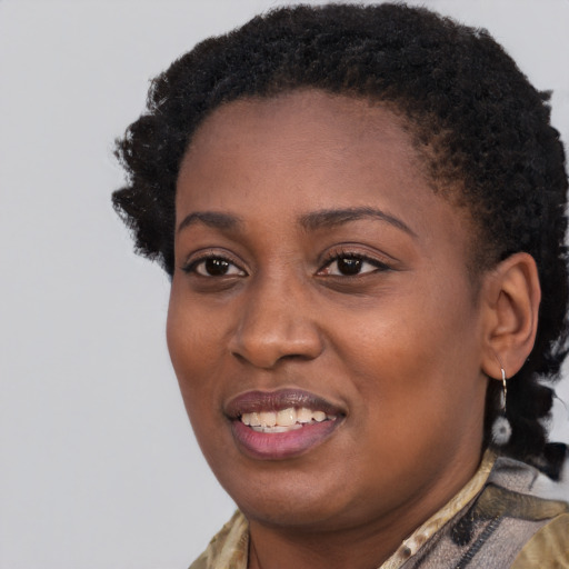 Joyful black young-adult female with short  black hair and brown eyes