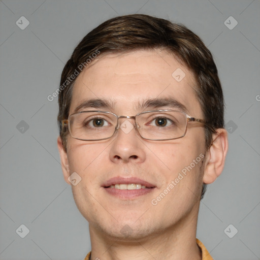 Joyful white adult male with short  brown hair and brown eyes