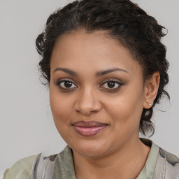 Joyful black young-adult female with medium  brown hair and brown eyes