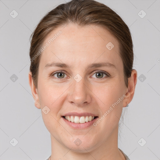 Joyful white young-adult female with short  brown hair and grey eyes