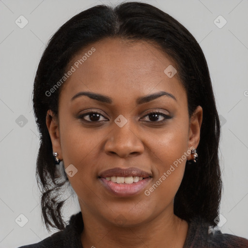 Joyful black young-adult female with long  brown hair and brown eyes