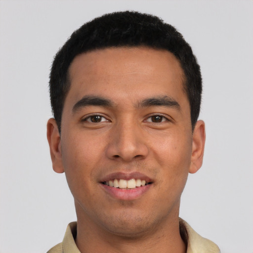 Joyful asian young-adult male with short  black hair and brown eyes