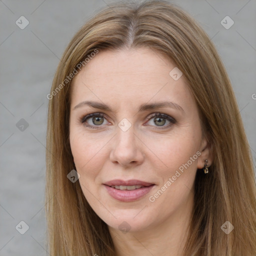 Joyful white adult female with long  brown hair and grey eyes