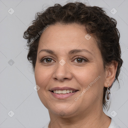 Joyful white adult female with short  brown hair and brown eyes