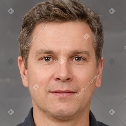 Joyful white adult male with short  brown hair and grey eyes