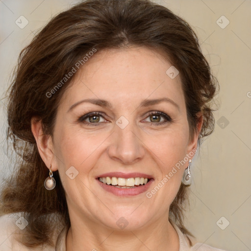 Joyful white adult female with medium  brown hair and grey eyes