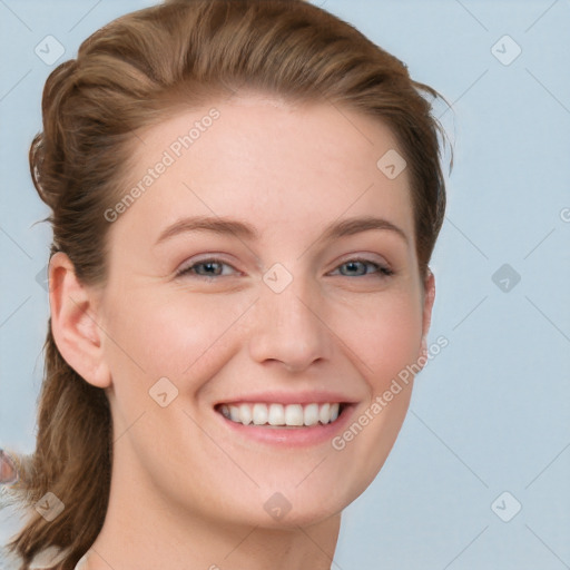 Joyful white young-adult female with long  brown hair and blue eyes