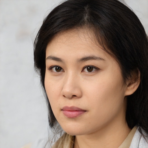 Neutral asian young-adult female with medium  brown hair and brown eyes