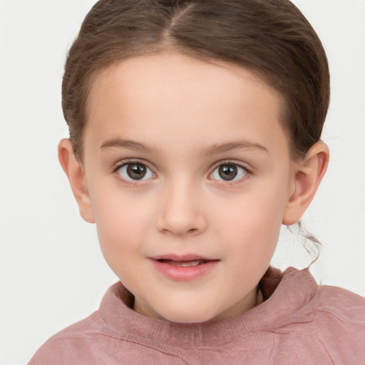 Joyful white child female with short  brown hair and brown eyes