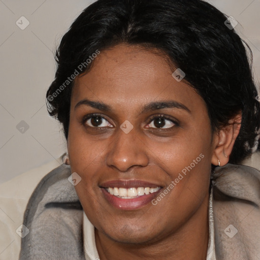 Joyful black young-adult female with long  brown hair and brown eyes