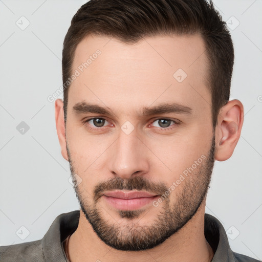 Neutral white young-adult male with short  brown hair and brown eyes