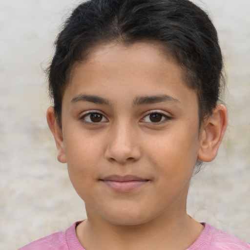 Joyful latino child female with short  brown hair and brown eyes