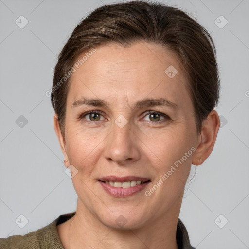 Joyful white adult female with short  brown hair and brown eyes