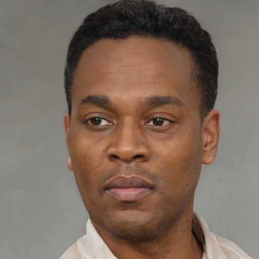 Neutral black young-adult male with short  black hair and brown eyes