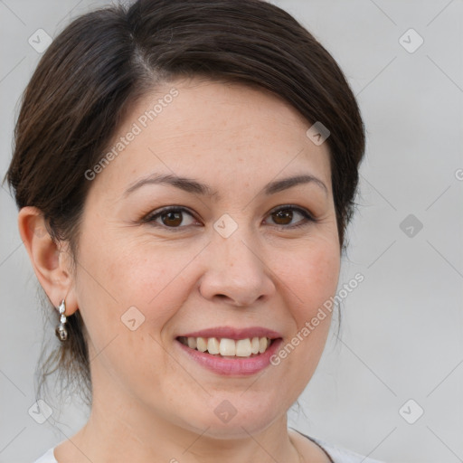 Joyful white adult female with medium  brown hair and brown eyes