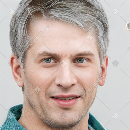 Joyful white adult male with short  brown hair and grey eyes