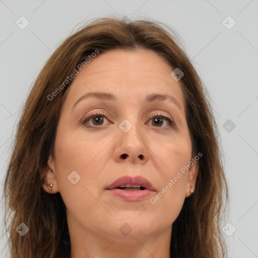 Joyful white adult female with long  brown hair and brown eyes