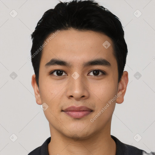 Joyful asian young-adult male with short  black hair and brown eyes