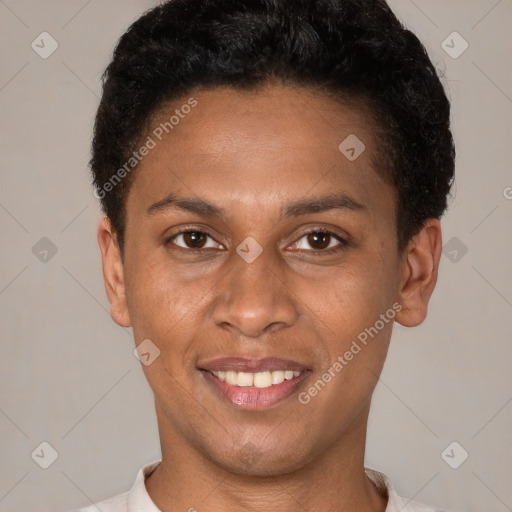 Joyful latino young-adult male with short  brown hair and brown eyes