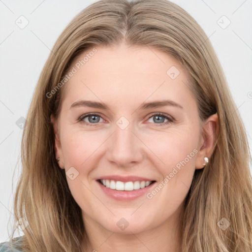 Joyful white young-adult female with long  brown hair and blue eyes