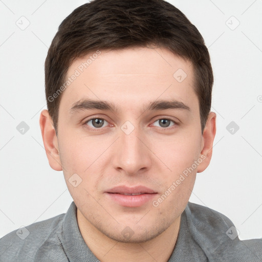 Neutral white young-adult male with short  brown hair and brown eyes