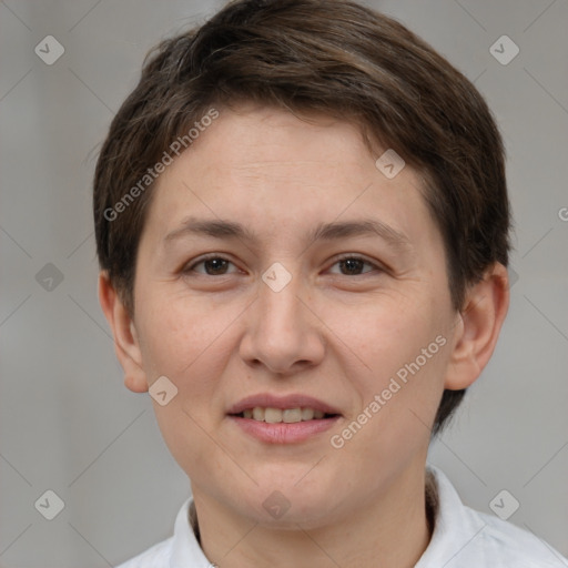 Joyful white adult female with short  brown hair and brown eyes