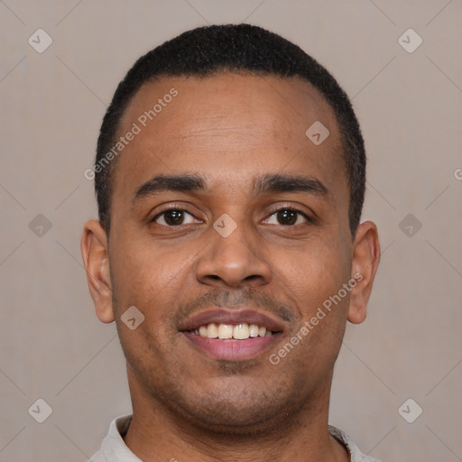 Joyful latino young-adult male with short  brown hair and brown eyes