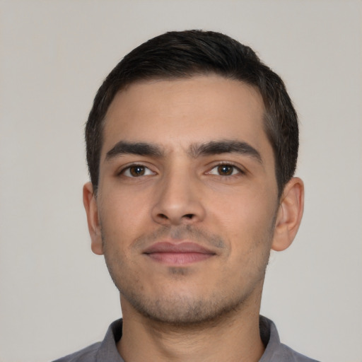 Neutral white young-adult male with short  black hair and brown eyes