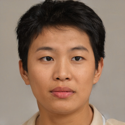 Joyful asian young-adult female with short  brown hair and brown eyes