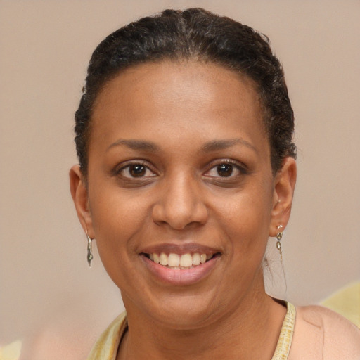 Joyful latino young-adult female with short  brown hair and brown eyes