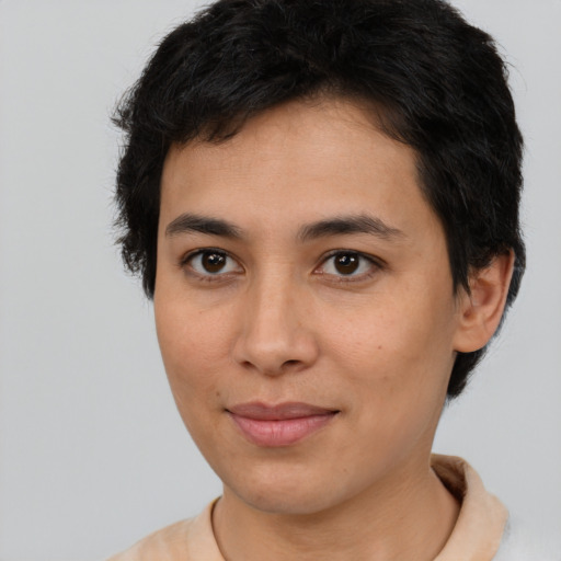 Joyful asian young-adult female with short  brown hair and brown eyes