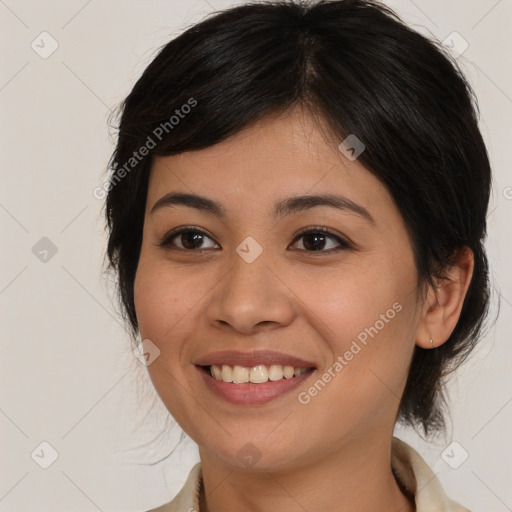 Joyful white young-adult female with medium  brown hair and brown eyes