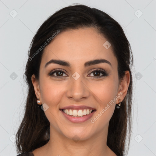 Joyful latino young-adult female with medium  brown hair and brown eyes