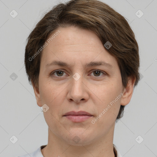 Joyful white adult female with short  brown hair and grey eyes