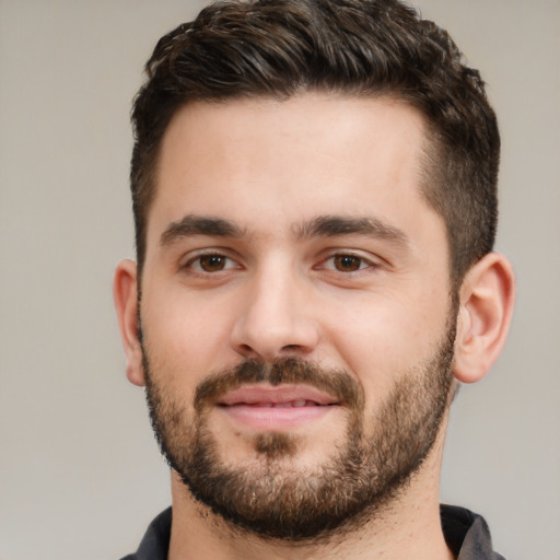 Joyful white young-adult male with short  brown hair and brown eyes