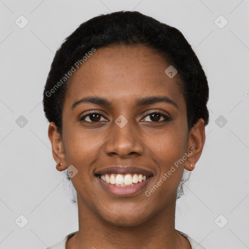 Joyful black young-adult female with short  brown hair and brown eyes