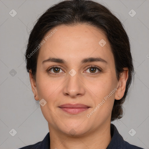 Joyful white adult female with medium  brown hair and brown eyes