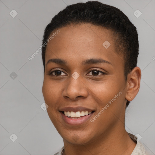 Joyful black young-adult female with short  brown hair and brown eyes