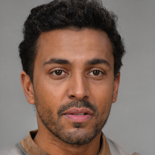 Neutral latino young-adult male with short  brown hair and brown eyes