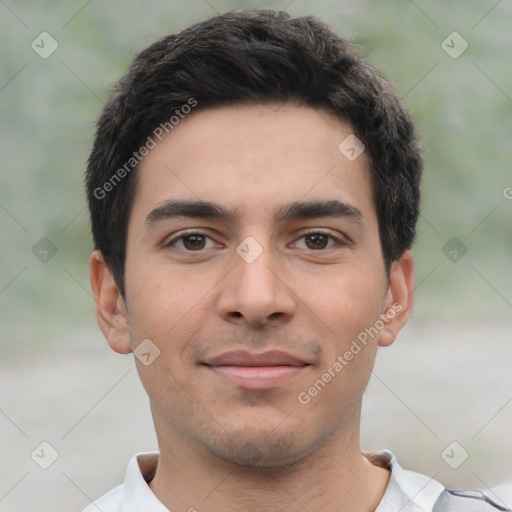 Joyful white young-adult male with short  black hair and brown eyes